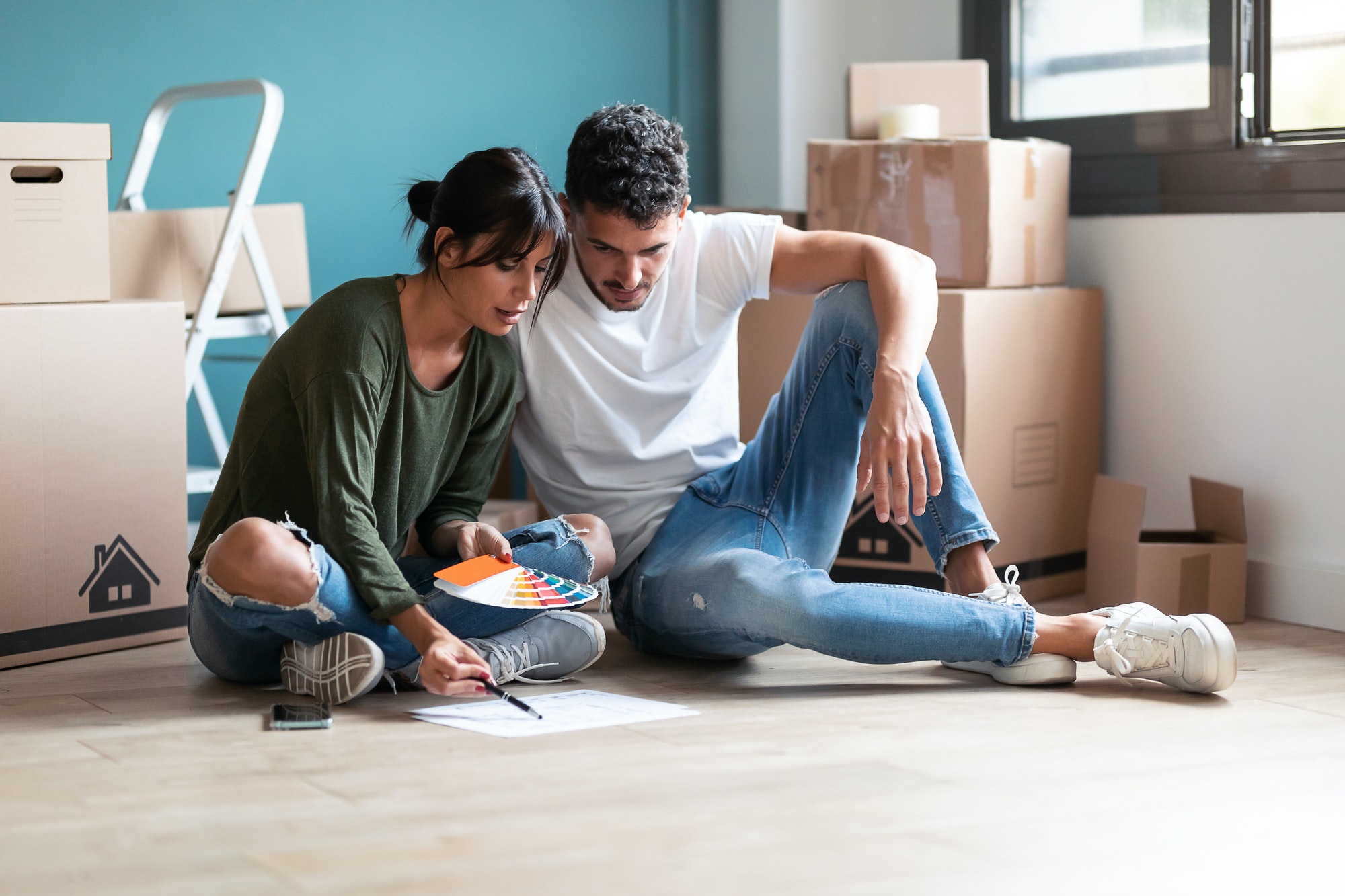 Couple choosing interior paint colours