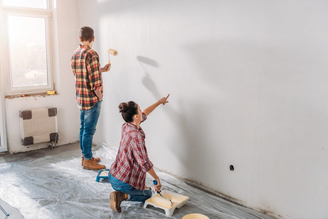 WallCarePro crew preparing a wall before painting