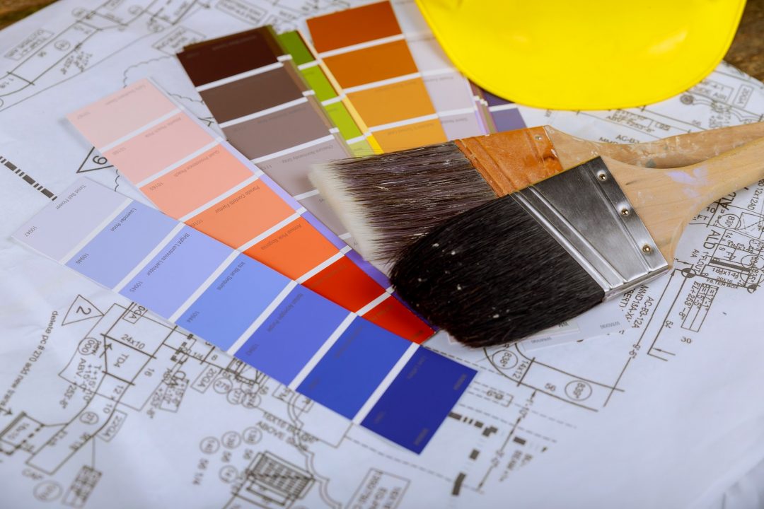 Paint colour swatches and brushes ready for a project